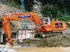 Hitachi UH801 excavating tailrace excavation adjacent 2nd tunnel portal 